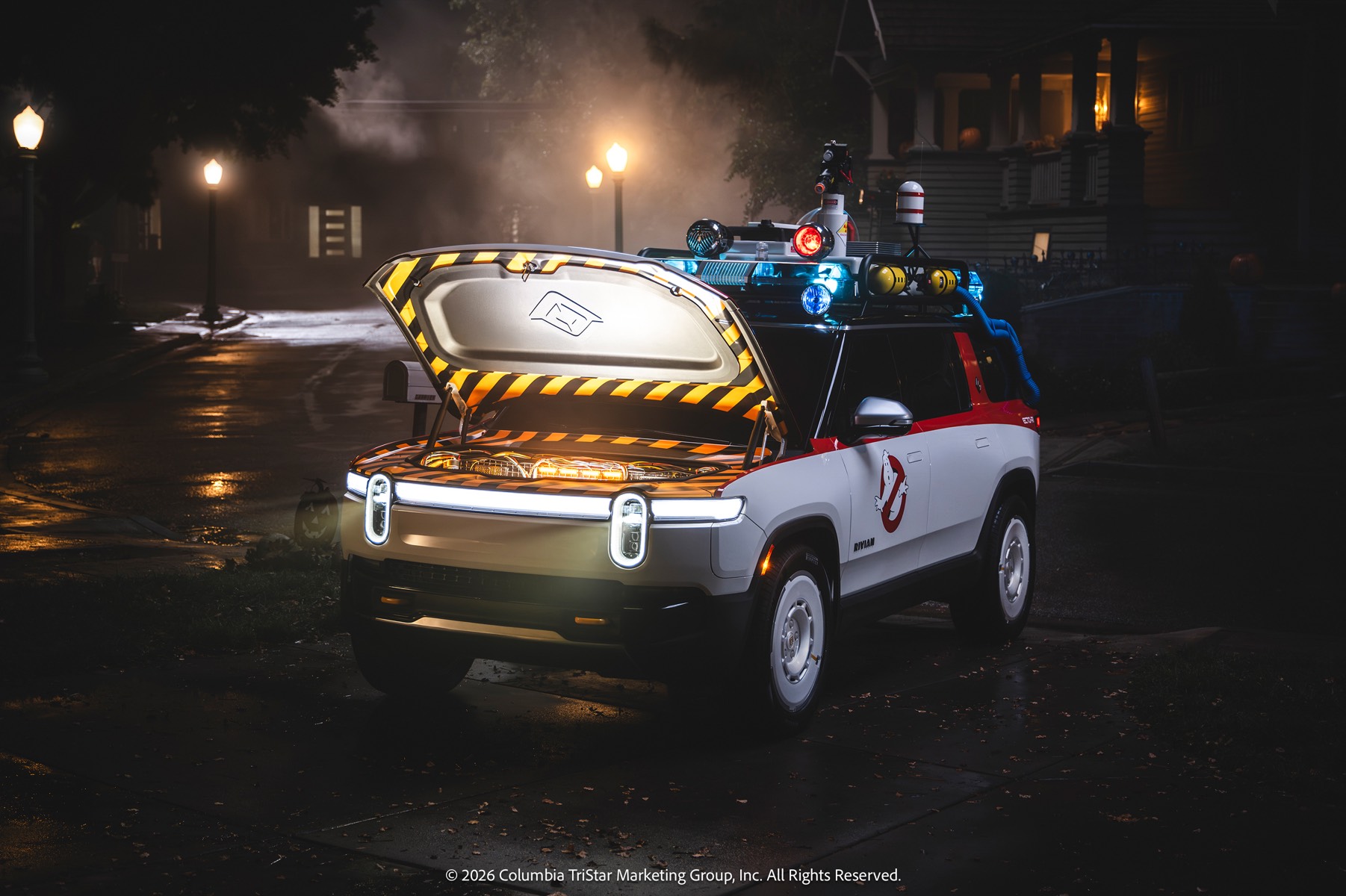 Rivian Ecto-R1 with its front trunk open at night